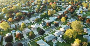 An arial photo of a suburban neighborhood before dusk