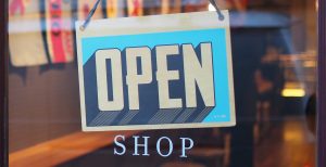 An open sign in a shop window.