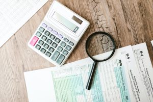 Desk with tax forms and calculator