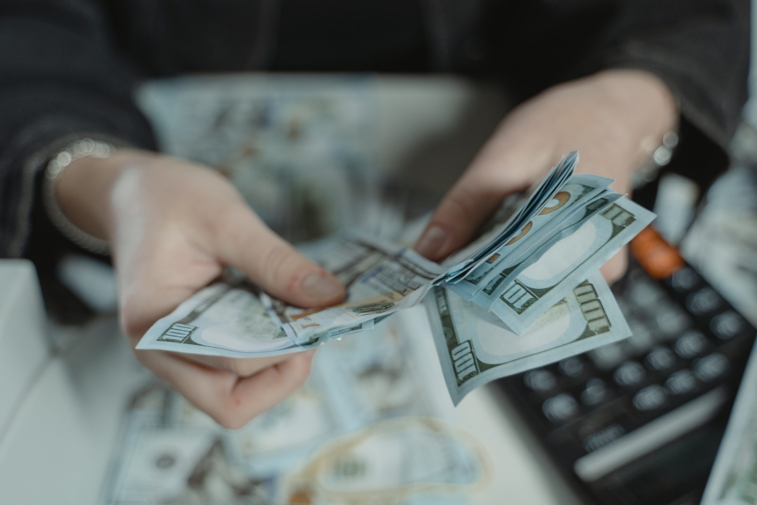 Close up on someone counting cash