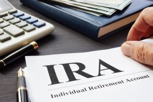 Documents about Individual retirement account IRA on a desk.