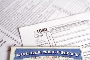 Tax forms and Social Security card as a business concept.