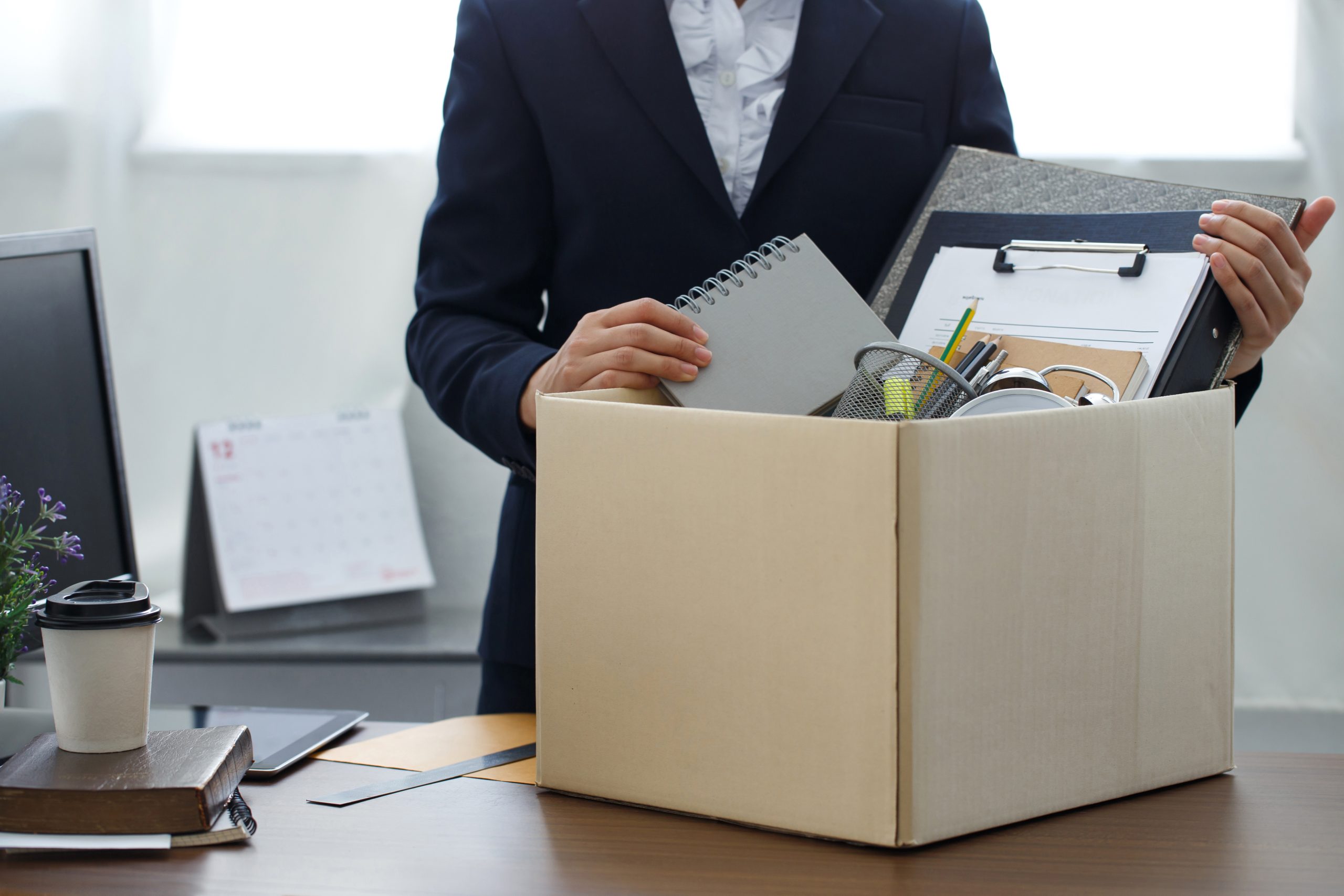 Resignation concept.Businesswoman packing personal company belongings when she deciding resignation change of job or fired from the company.